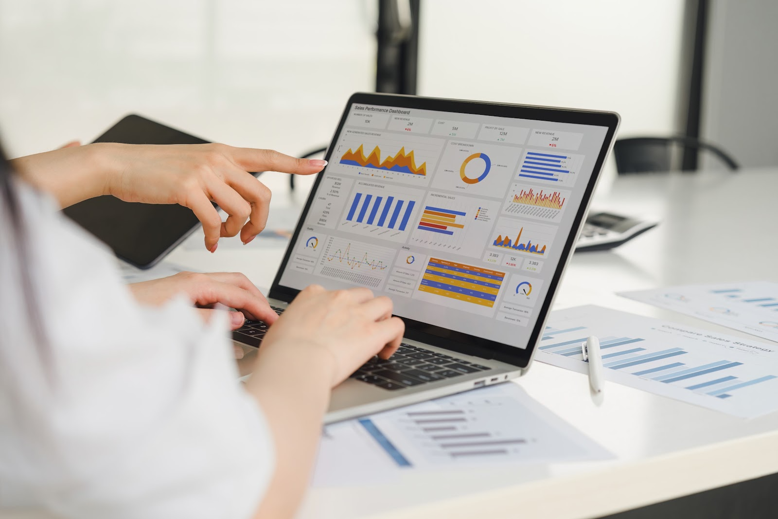 people looking at software on a laptop