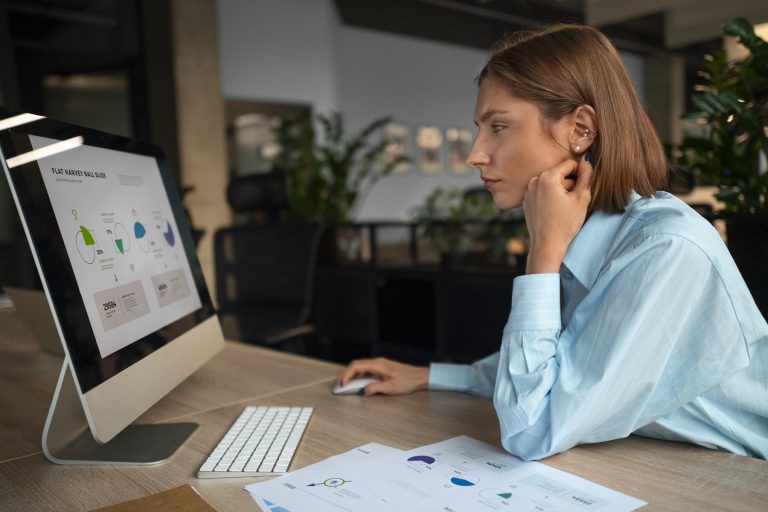 Woman looking at sales graphs